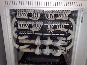 Server rack with Ethernet switches and patch panels ready to move